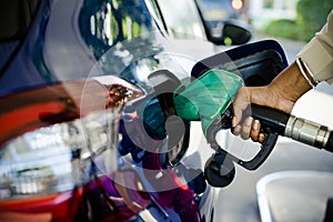 Man filling up gas in his car