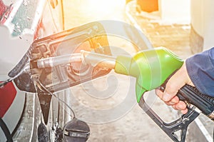 Man fills the gas tank of the car. The concept of price changes for petroleum products and petrol