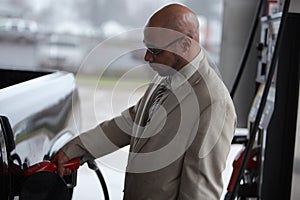 A man fills his fuel tank