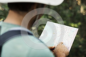 Man finding direction using a map