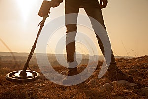 A man finding treasure and metals with recreational metal detector