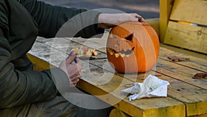 Man finished carving pumpkin