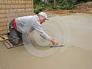 Man finishing concrete slab