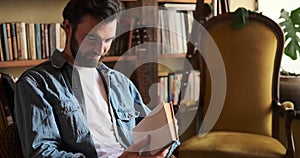 Man finishing reading and keeping book on shelf