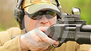 A man fires a rifle
