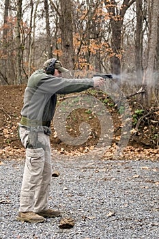 Man Firing Pistol