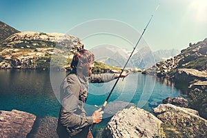 Man Fisherman fishing with rod alone