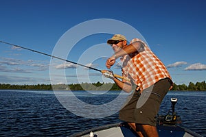 Man Fishing Large Mouth Bass photo