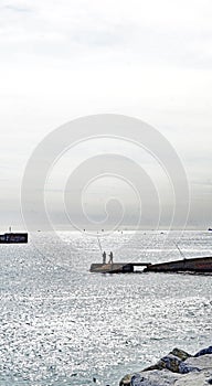 Man fishing on Badalona beach, Barcelona