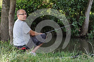 Man fishing in creek