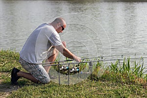 Man fishing at lake, Carp fishing