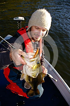 Man Fishing For Largemouth Bass in Cold Weather