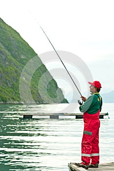 Man fishing in Norwegian fjord