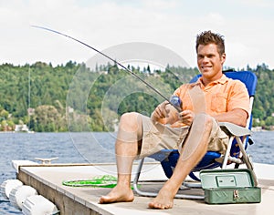 Man fishing on pier