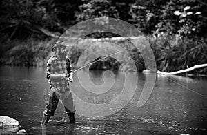Man with fishing rod, fisherman men in river water outdoor. Summer fishing hobby.