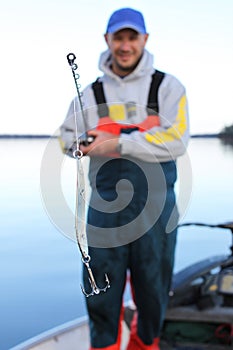 Man With Fishing Rod And Lure