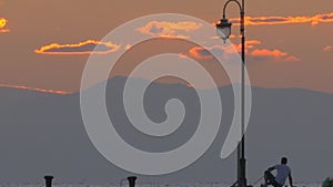 Man Fishing in Twilight