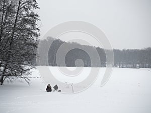 Man fishing on winter