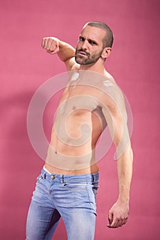 Man fist punching, pink background