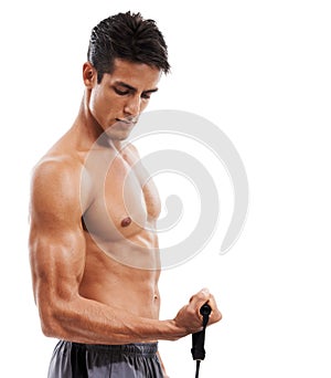 Man, fitness and bicep with resistance band in workout or training on a white studio background. Active male person or