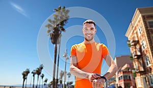 Man with fitness tracker training outdoors