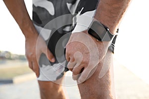 Man with fitness tracker after training outdoors