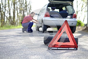 Man fixing a car problem