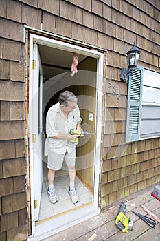 Man fixing door