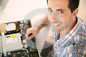 Man fixing electronic appliance photo