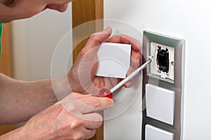 Man fixing the light switch
