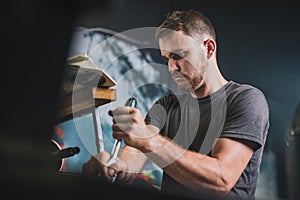 Man fixing an outboard engine