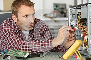 man fixing pc computer