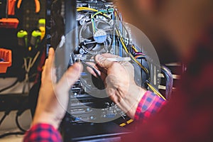 Man fixing PC in professional workshop