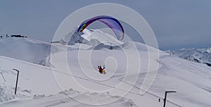 A man flies a hang glider in the Krasnaya Polyana ski resort, Sochi, Russia