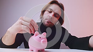 Man flipping coin and putting it into the piggy bank. Savings and financial management concept