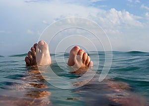 Man floating on the beach in vacations