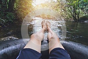 Man floating down a canal photo