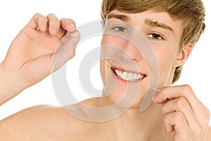 Man flossing his teeth photo