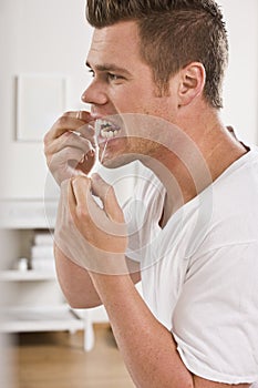 Man Flossing Teeth photo