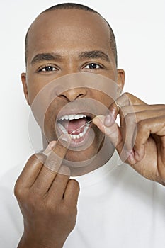 Man Flossing Teeth photo