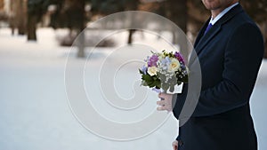 Man with flowers bouquet waiting