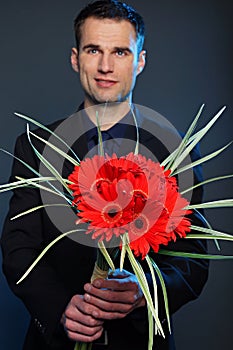 Man with flowers of gerberas