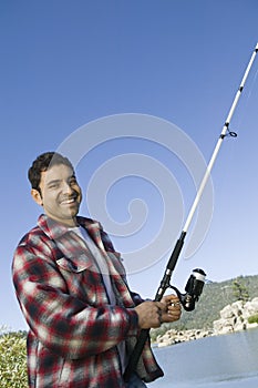 Man fly fishing on lake