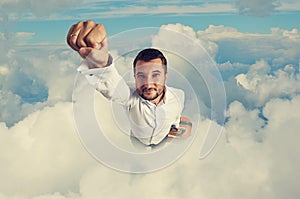 Man flying through the clouds