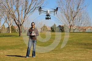 Man Flying a High-Tech Camera Drone