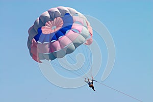 Man flying on parachute