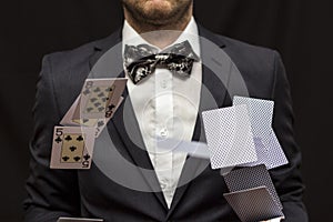 Man with flying playing cards
