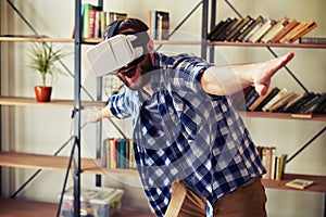 Man flying in virtual reality using modern VR headset glasses
