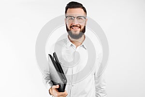 Man with a folder in his hands, on a white background, businessman with glasses