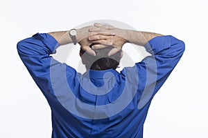 Man foldind hands over head, horizontal